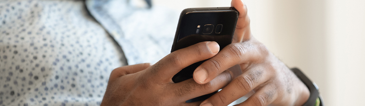 Close up of hands banking by smartphone with Hometown Banks