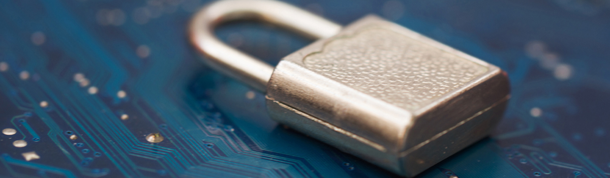 Padlock laying on circuit board