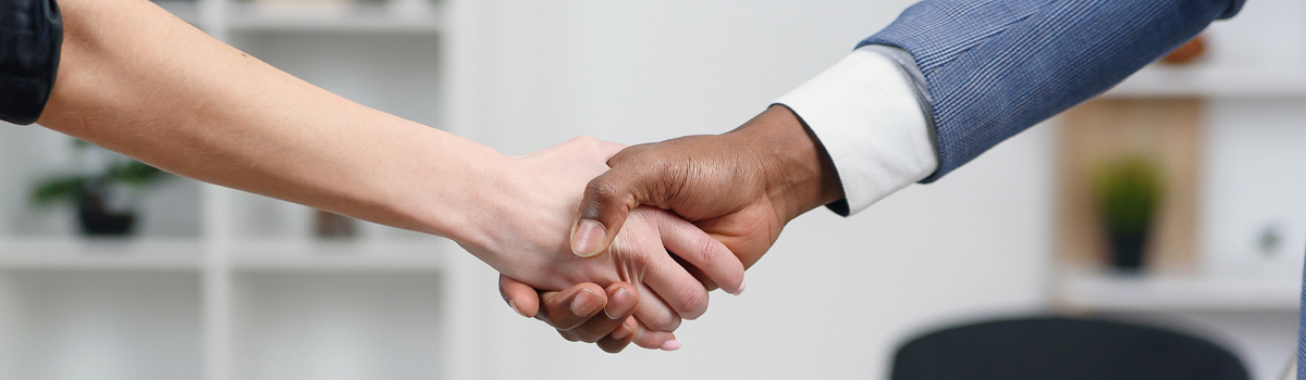 Man and woman shaking hands